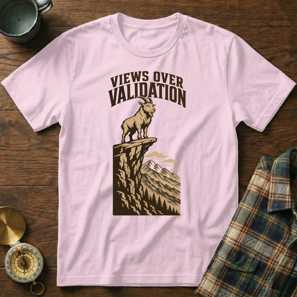 Pink t-shirt with illustration of goat on cliff, "Views Over Validation" text.