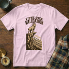 Pink t-shirt with illustration of goat on cliff, "Views Over Validation" text.