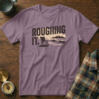 T-shirt with "ROUGHING IT." text and a beach scene graphic.