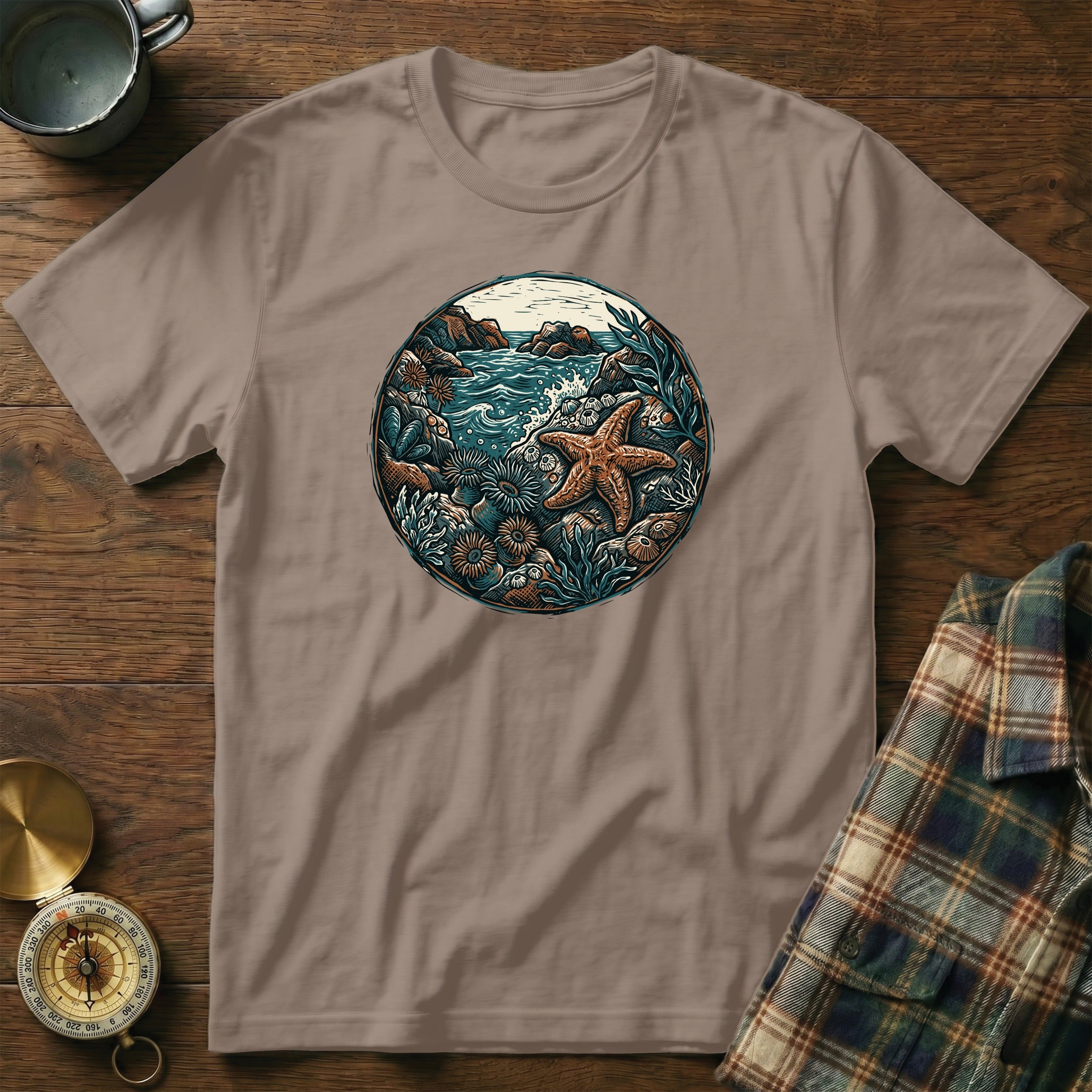 T-shirt featuring a circular marine scene with a starfish and ocean flora.