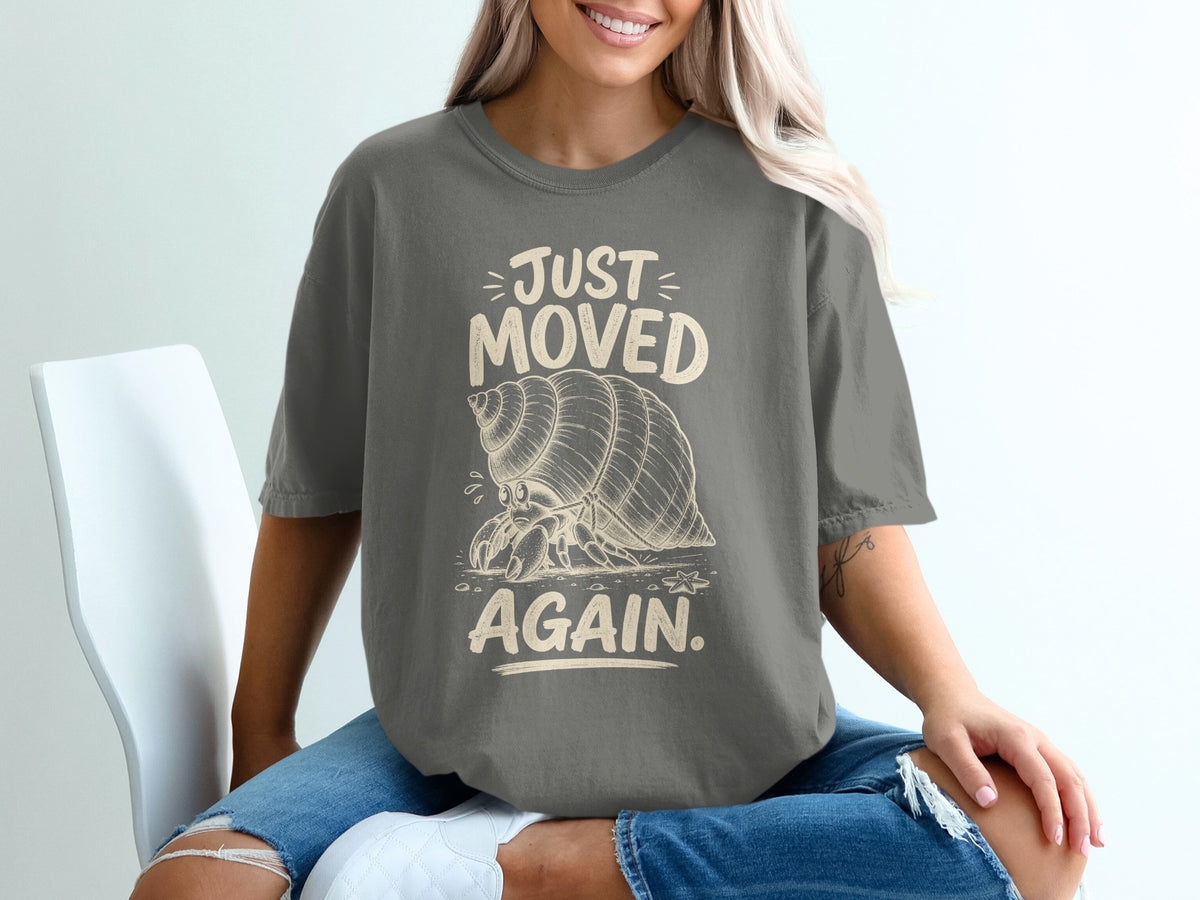 Gray t-shirt with "JUST MOVED AGAIN." and a hermit crab graphic.