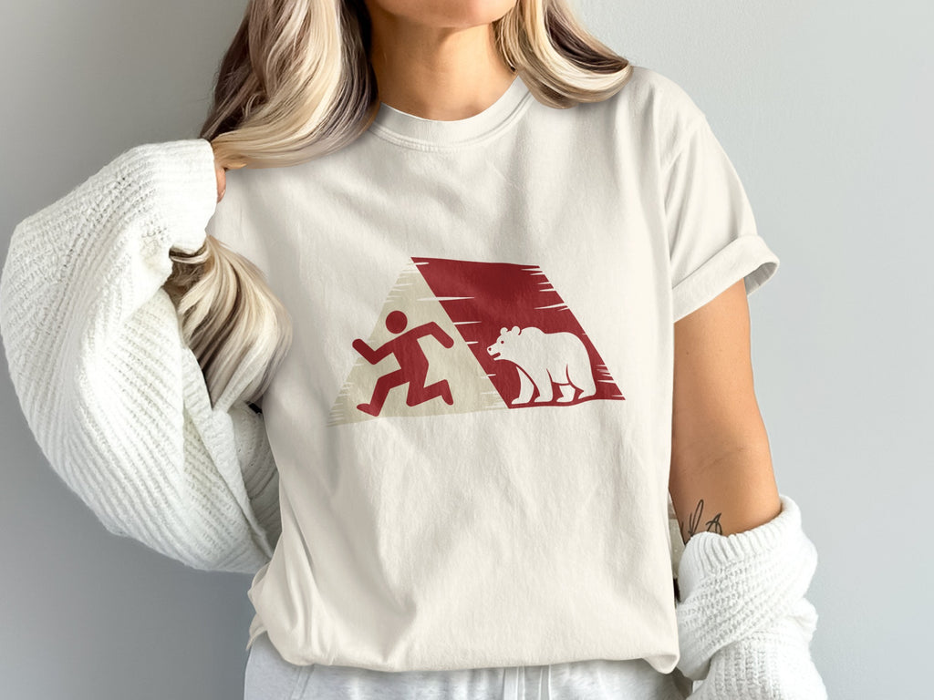 White t-shirt with abstract running man and bear design in red.