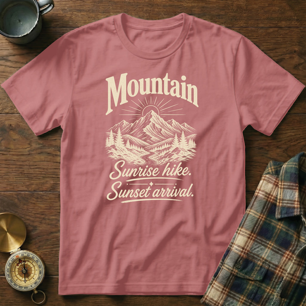 Dusty pink crewneck t-shirt featuring a vintage mountain graphic and the text Mountain Sunrise hike. Sunset arrival.