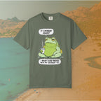 Green T-shirt Funny T-shirt graphic featuring a large, grumpy toad holding a to-go coffee cup. The cartoon is captioned with the quotes: "IT'S MONDAY AGAIN? I WASN'T EVEN FINISHED WITH MY SATURDAY YET.