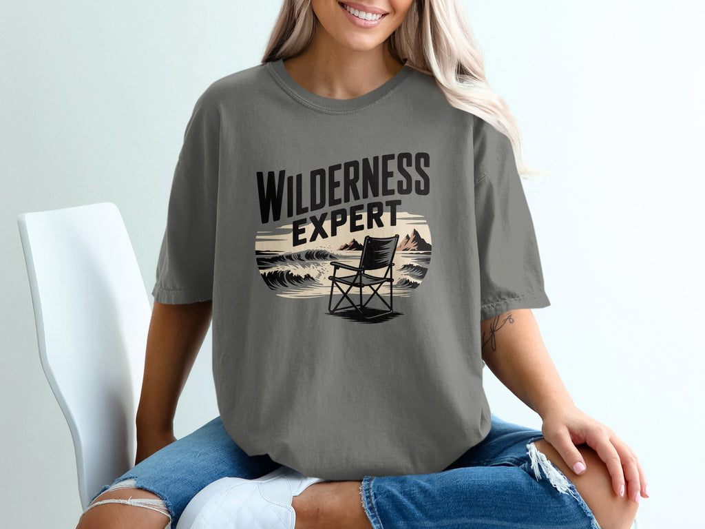 T-shirt with "Wilderness Expert" text and a beach scene with a chair.