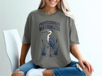 Gray t-shirt with "PROFESSIONALLY MOTIONLESS" and heron graphic.