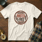 White t-shirt with "ROOTED & FREE" distressed circular graphic.