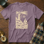 T-shirt with a vintage lighthouse and sailboat design.
