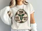 T-shirt graphic: "1984," "Brave New World," "Fahrenheit 451," "You Are Here"