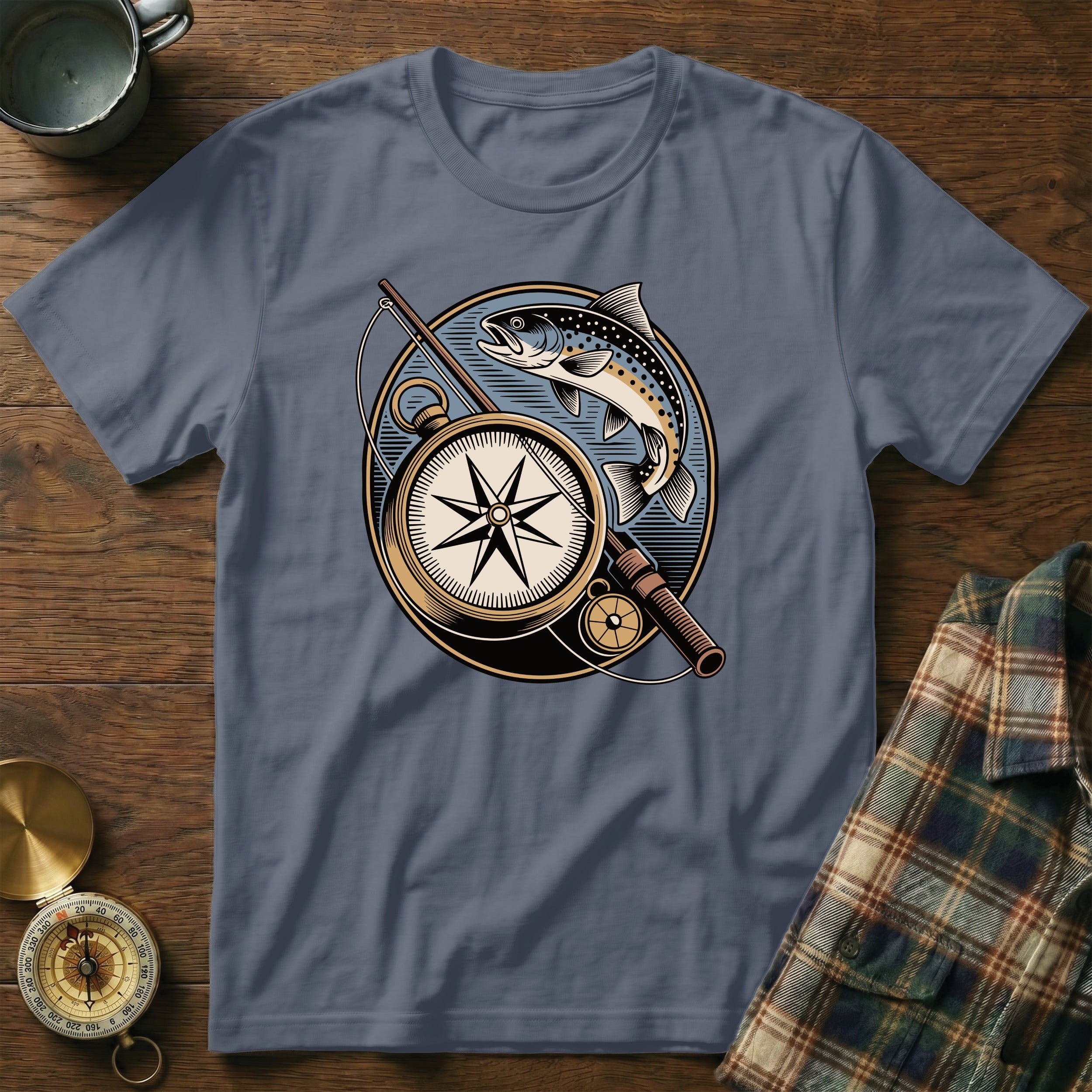 T-shirt graphic featuring a compass, fishing rod, and trout design.