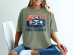 T-shirt with cassette tape graphic featuring mountains, sun, and text "CHASE THE HORIZON."