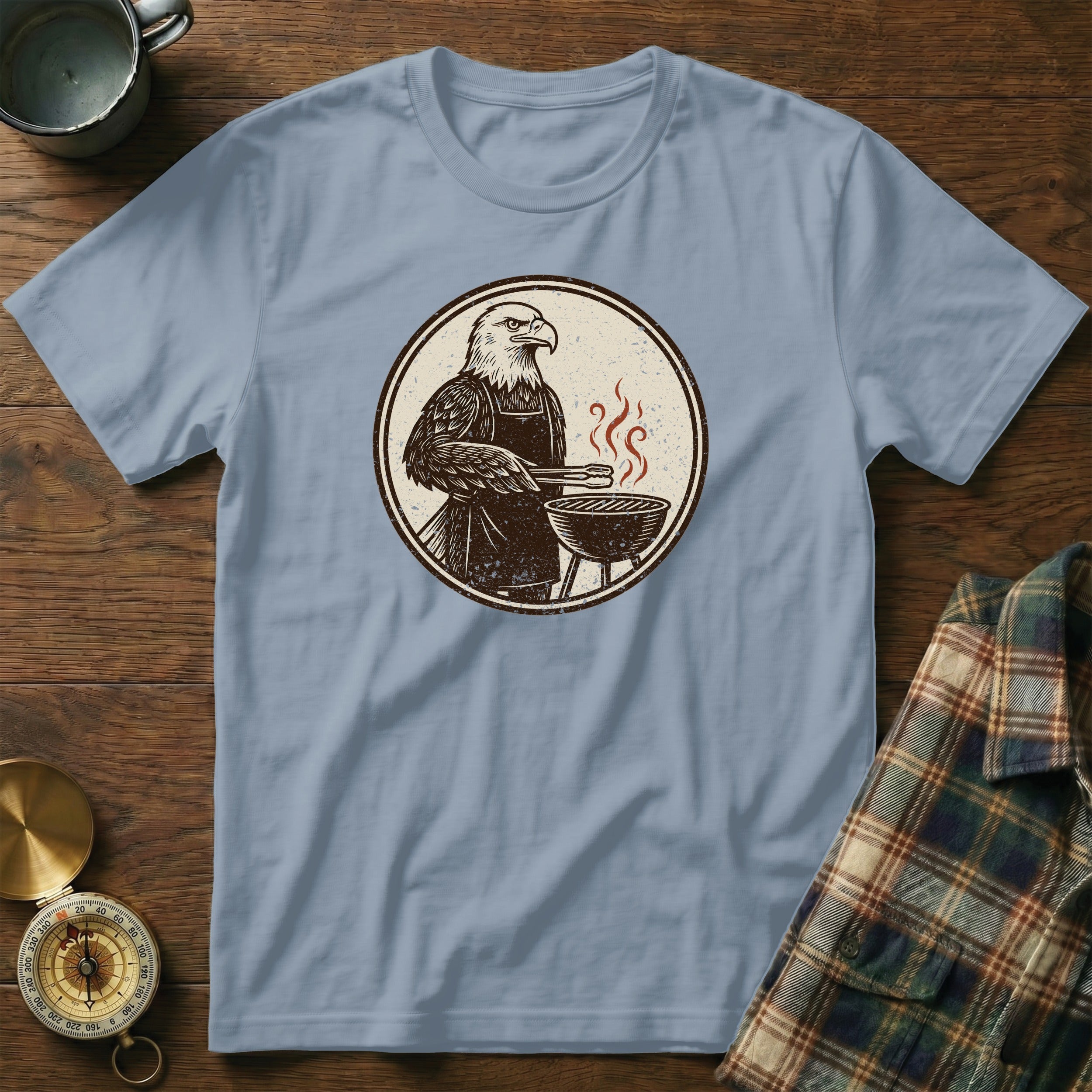 T-shirt with a vintage illustrated eagle grilling on a barbecue.