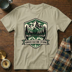 T-shirt with mountain lake forest motif and "NOWHERE NEAR DONE EXPLORING" text.