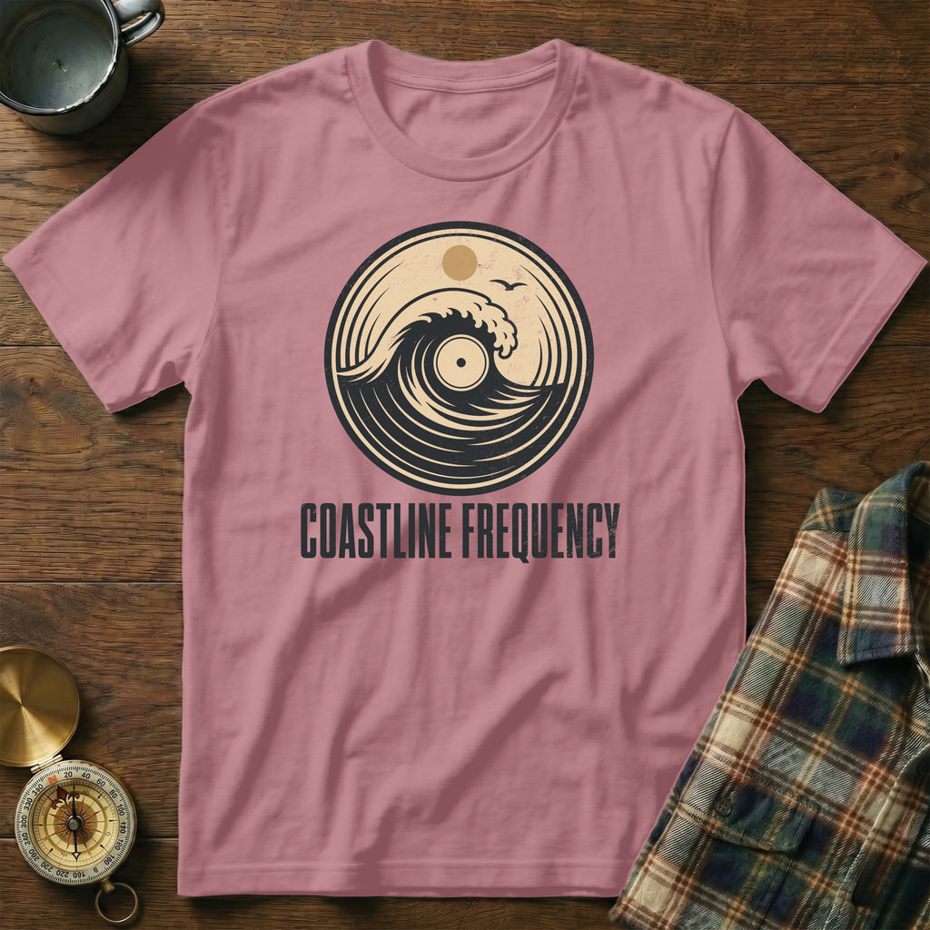Pink t-shirt with vintage wave and vinyl record graphic, "Coastline Frequency" text.