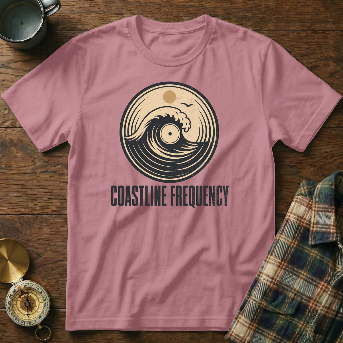 Pink t-shirt with vintage wave and vinyl record graphic, "Coastline Frequency" text.