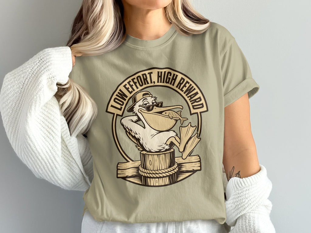 Pelican wearing sunglasses and hat with a fish in its beak, text "LOW EFFORT, HIGH REWARD".