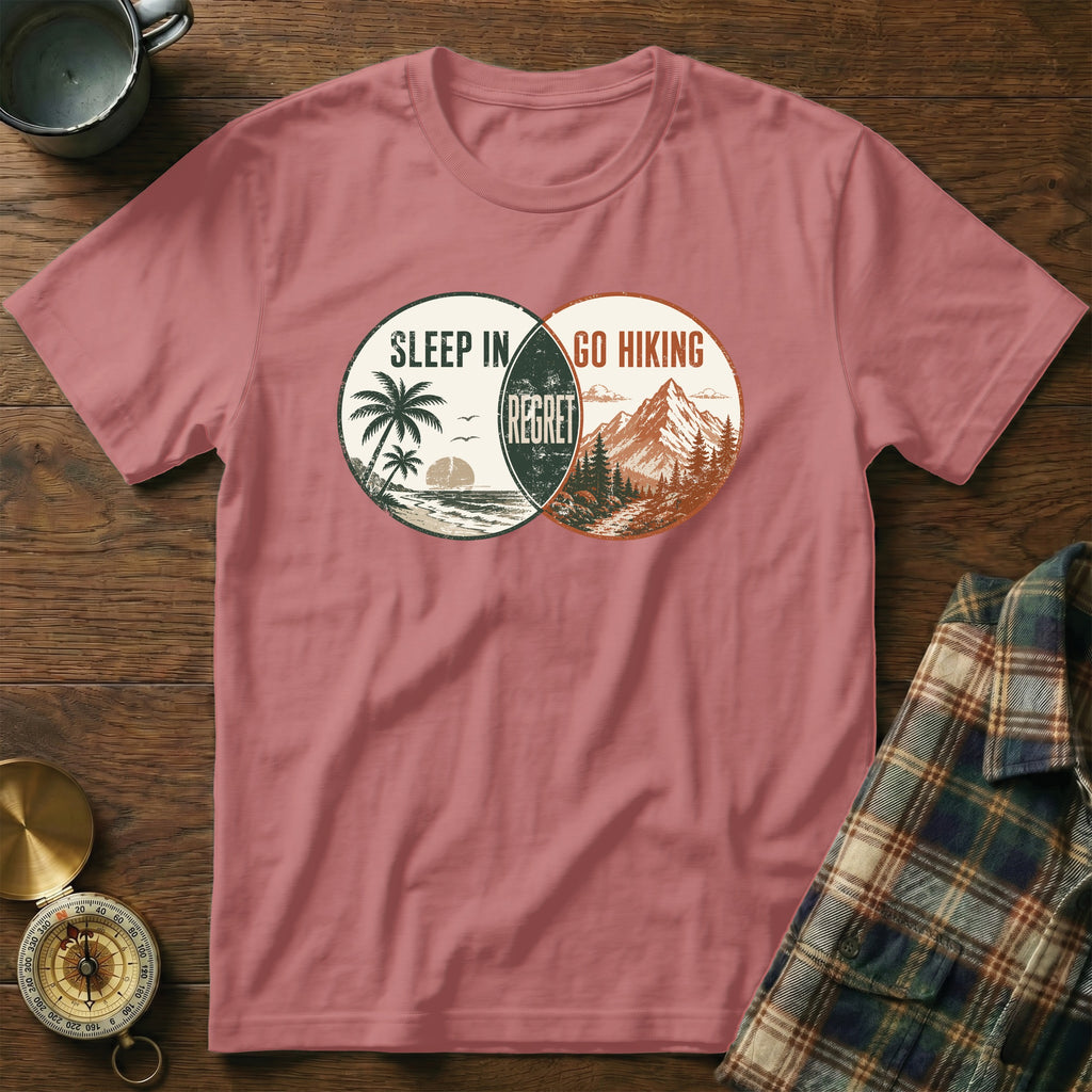 T-shirt with "Sleep In Regret Go Hiking" graphic and beach, mountain scenes.