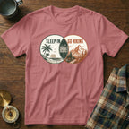 T-shirt with "Sleep In Regret Go Hiking" graphic and beach, mountain scenes.