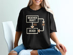 Black t-shirt with flowchart graphic reading "Weather Okay?" leading to "Yes" and "Beach" or "No".