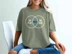 Green t-shirt with overlapping circles graphic and text "The Plan Rarely The Trail".