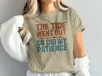 Tan t-shirt with red and blue text reading "THE TIDE WENT OUT SO DID MY PATIENCE".