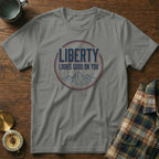 Grey t-shirt with "LIBERTY LOOKS GOOD ON YOU" text and mountain graphic.