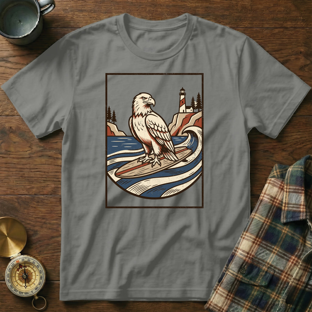 Eagle surfing on a wave with a lighthouse on a rocky coast.