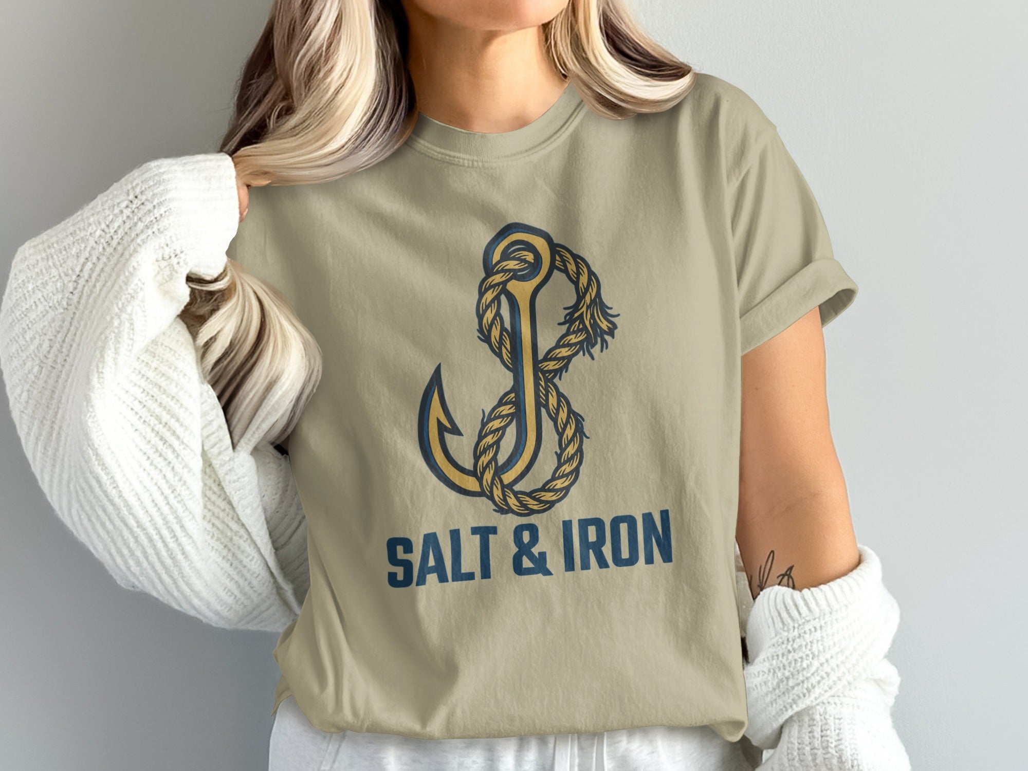Tan t-shirt featuring a nautical anchor and rope design with "SALT & IRON" text.