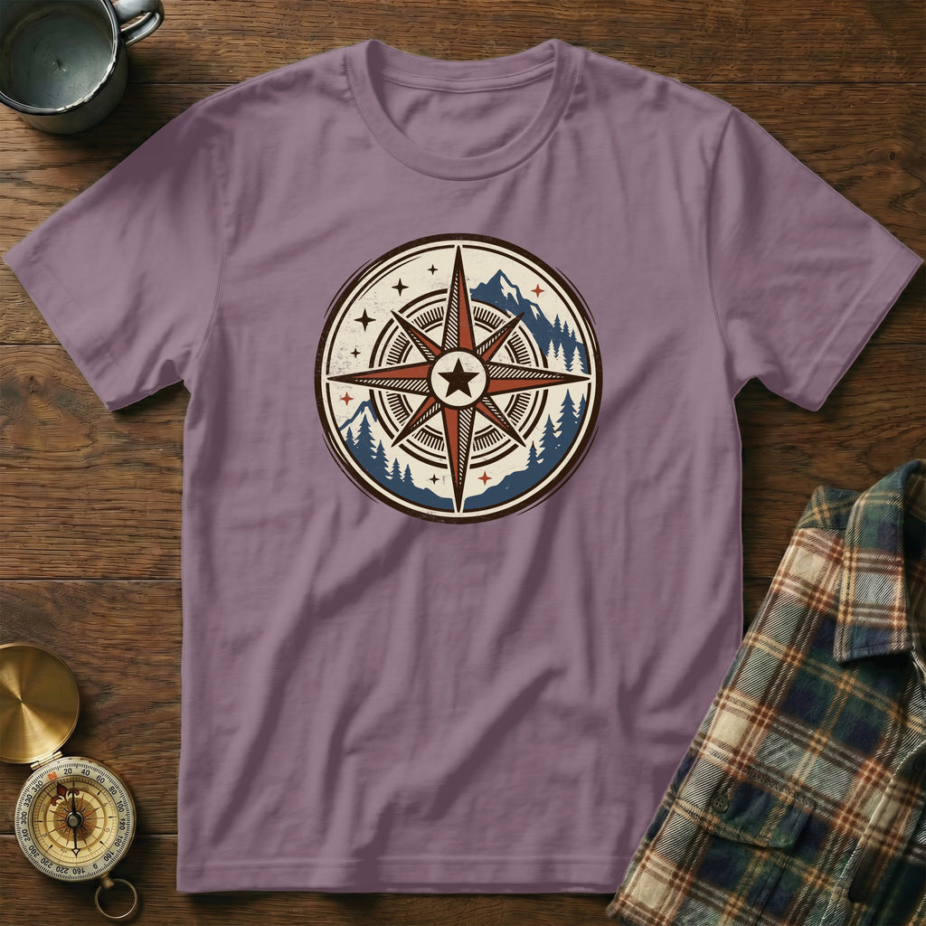 Purple t-shirt with a vintage compass and mountain graphic design.