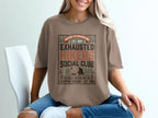 Brown t-shirt with "Exhausted Hikers Social Club" text and campfire design.