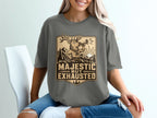 T-shirt graphic with deer blowing horn and text "Majestic But Exhausted"