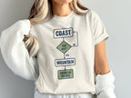 Flowchart t-shirt with "Coast," "Too Hot?", "Mountain," and "Problem Solved" text.