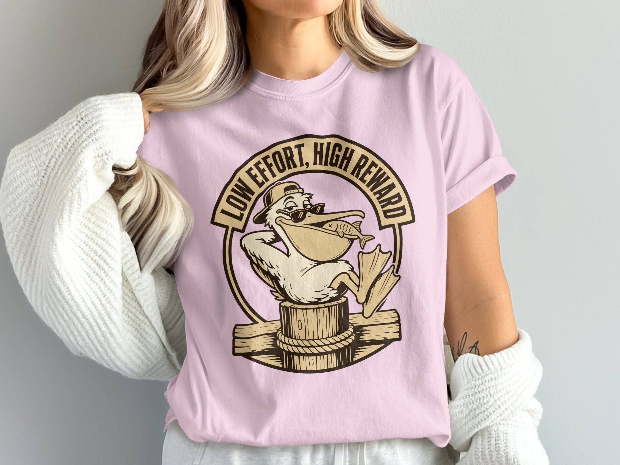 Pelican in sunglasses with fish and text "LOW EFFORT, HIGH REWARD".