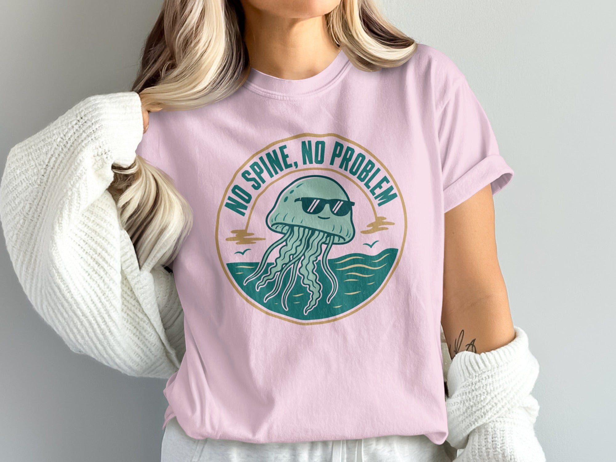 Pink t-shirt with graphic of cool jellyfish and text "NO SPINE, NO PROBLEM".