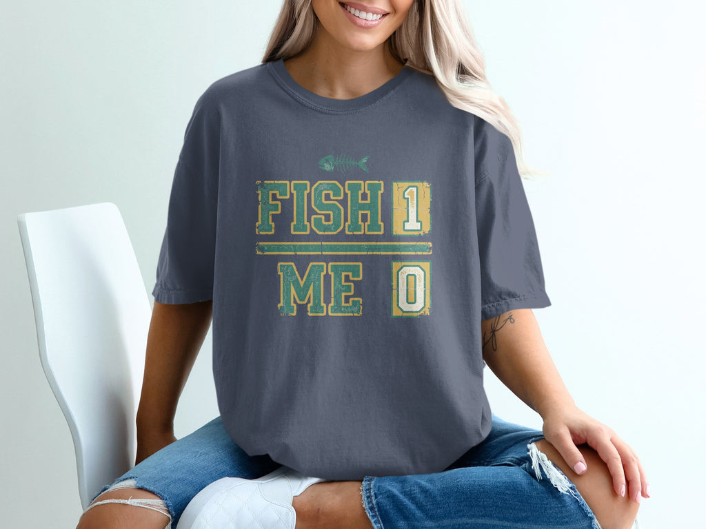 Dark grey t-shirt with "Fish 1 Me 0" graphic.