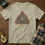 Light tan t-shirt with a mountain-shaped graphic in brown and orange concentric lines.