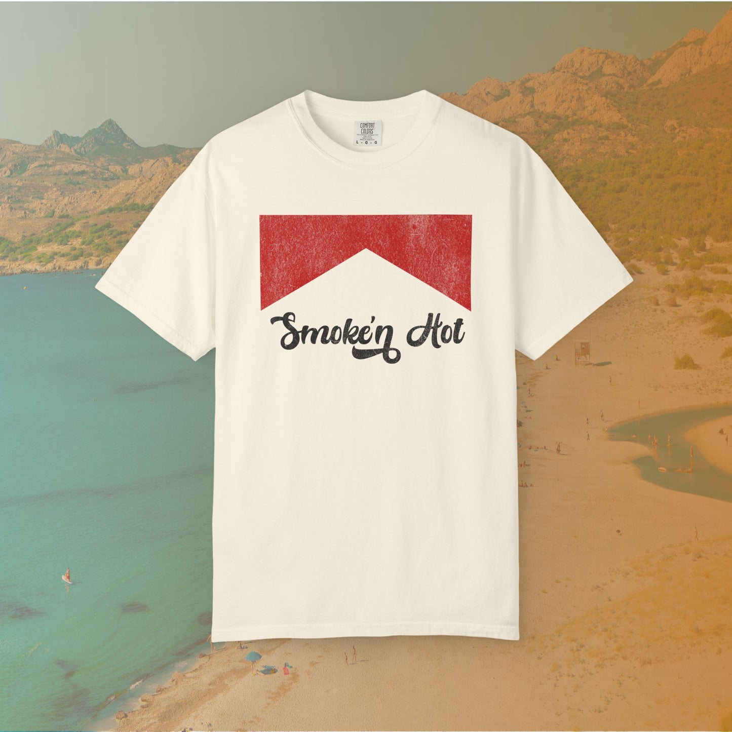 ivory Graphic T-shirt featuring a distressed red chevron shape with the black script text "Smokin' Hot" centered below it, in a vintage style.