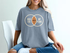 Blue t-shirt with "High Tide Canceled My Plans" Venn diagram graphic.