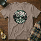 T-shirt with a circular graphic of a mountain lake and pine trees.