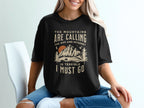 Black t-shirt with "The mountains are calling, the WiFi and internet is terrible I must go" graphic.