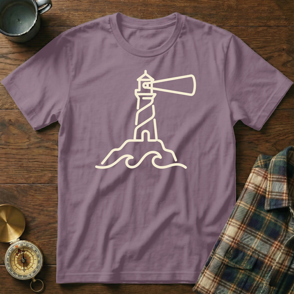 Purple t-shirt with a cream outline graphic of a lighthouse on waves.