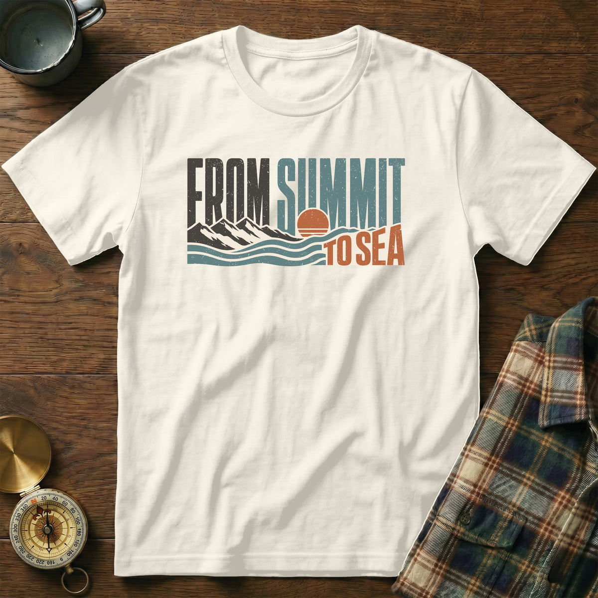 Cream t-shirt with "FROM SUMMIT TO SEA" text, mountains, and ocean graphic.