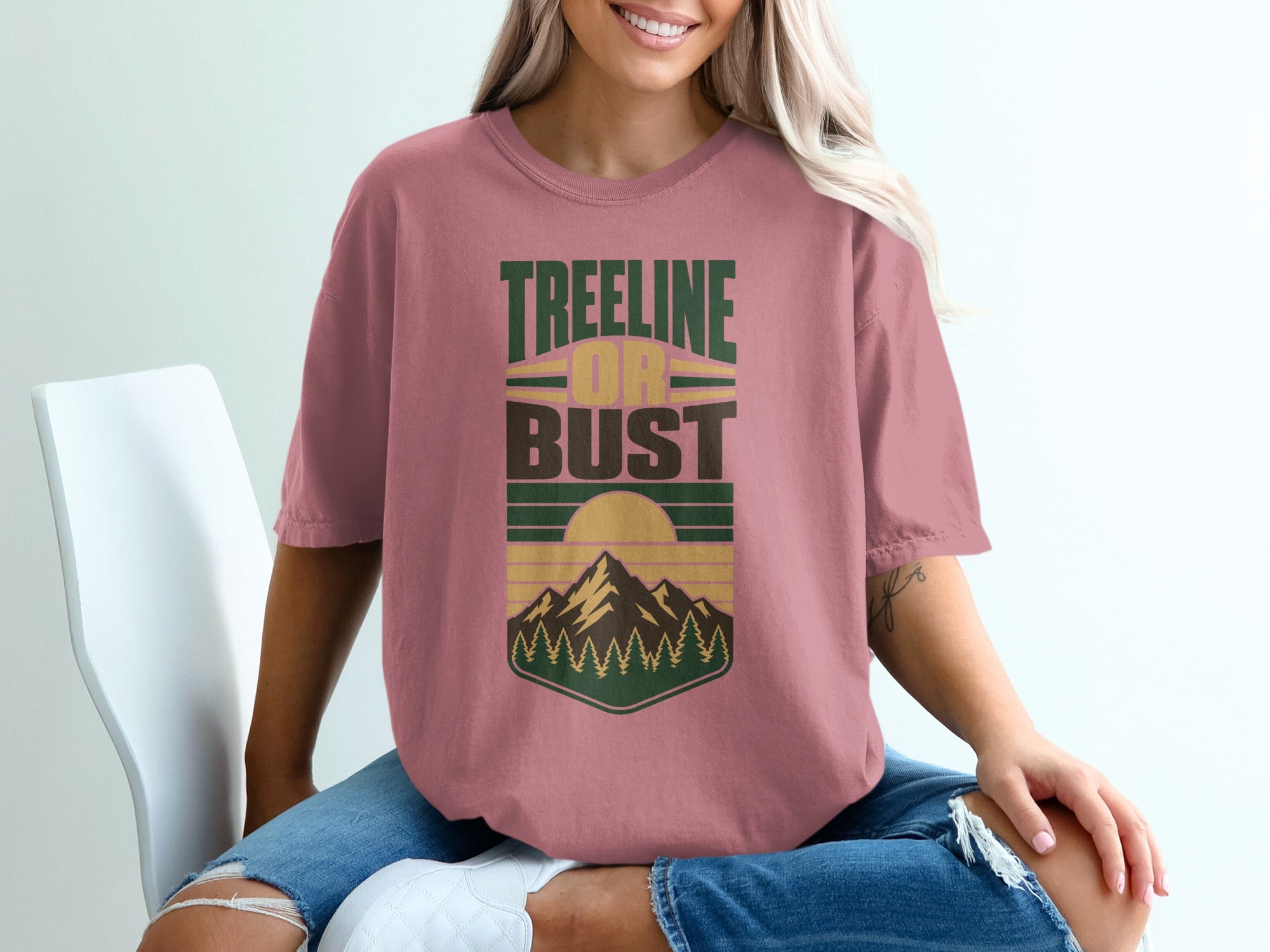 Rose t-shirt with "Treeline or Bust" text and mountain landscape graphic.
