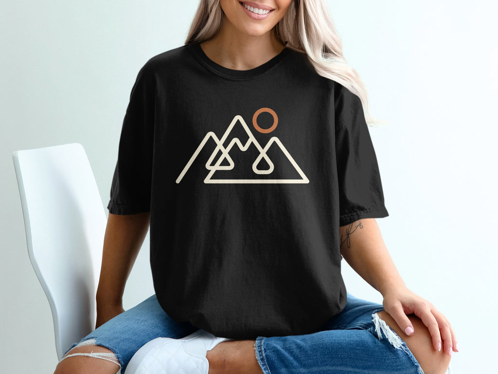 Black t-shirt with minimalist mountain range and sun graphic.