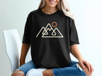 Black t-shirt with minimalist mountain range and sun graphic.