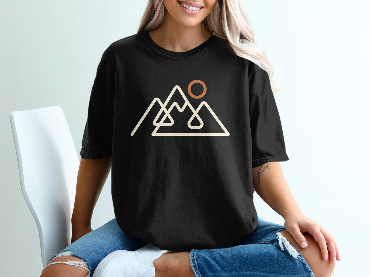 Black t-shirt with minimalist mountain range and sun graphic.