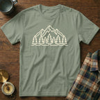 Sage green t-shirt with white mountain and tree graphic.