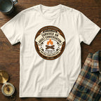 White t-shirt with a circular badge reading "Survived an adult conversation".