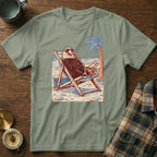 T-shirt graphic of an eagle wearing sunglasses relaxing in a beach chair.