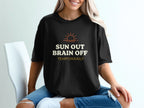 Black t-shirt with "SUN OUT BRAIN OFF TEMPORARILY" text and a sun graphic.